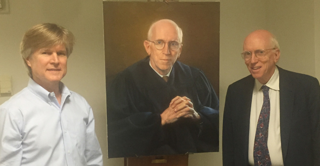 Artist Steve Craighead and Judge Smith pose with the finished portrait
